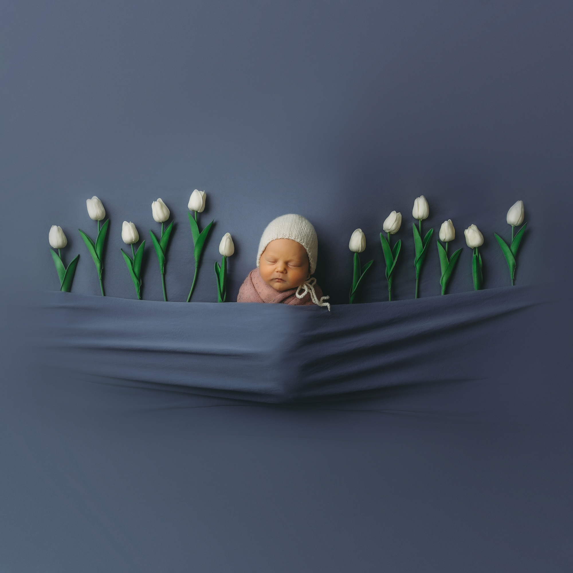 Newborn portrait with tulips