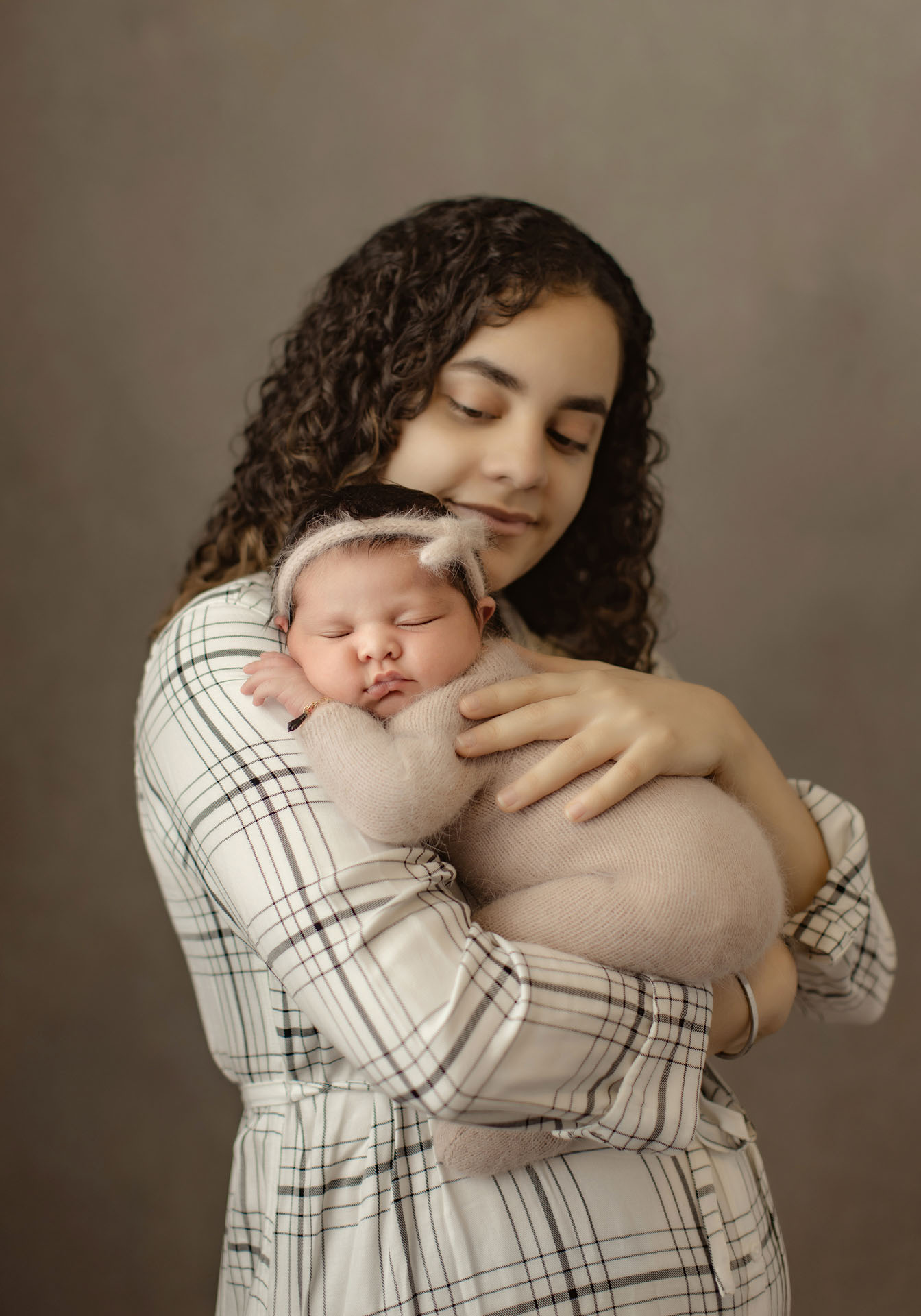 Mom and newborn baby girl portrait