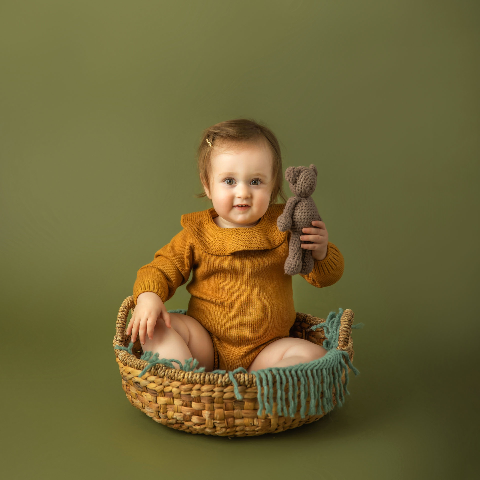 Milestone portrait of toddler in basket